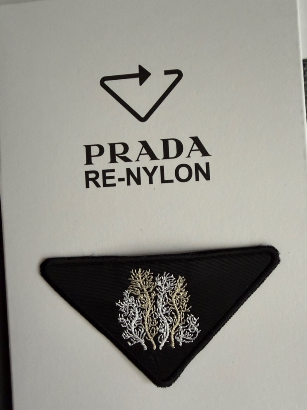 Prada Re-Nylon Triangle Patch — Black with White/Silver Coral y.